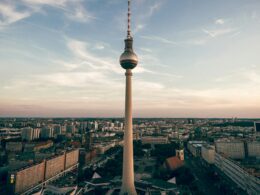 Berlin's Fernsehturm television tower rising above the city skyline at dusk