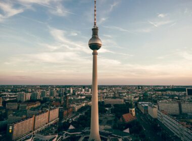 Berlin's Fernsehturm television tower rising above the city skyline at dusk