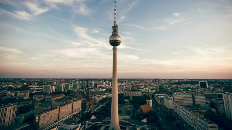 Berlin's Fernsehturm television tower rising above the city skyline at dusk