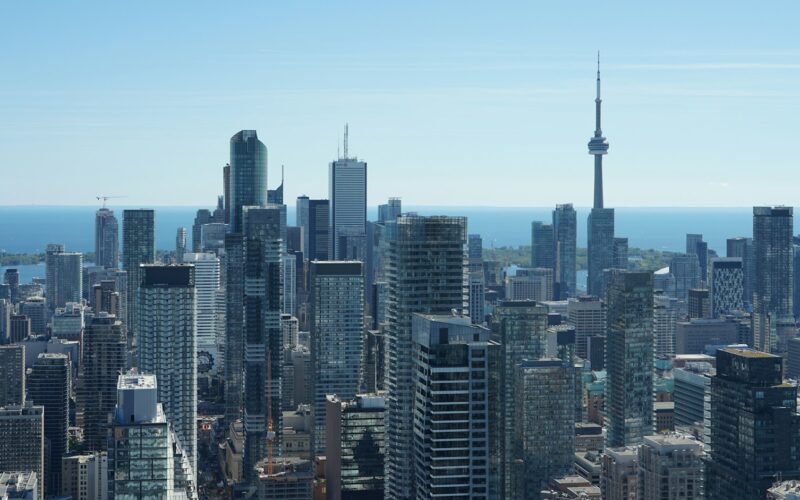 Toronto financial district skyline with the CN Tower and Lake Ontario behind it