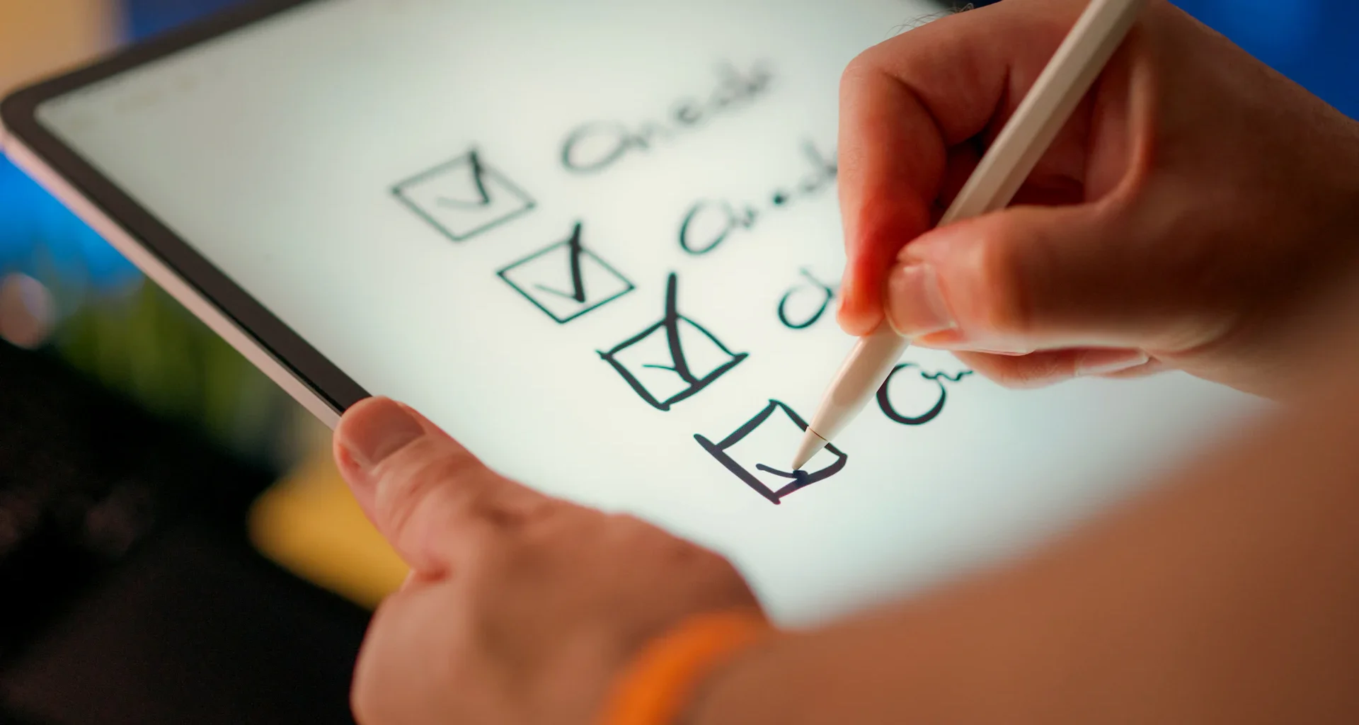 A hand marks off items on a checklist
