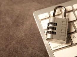 A padlock rests on a computer keyboard