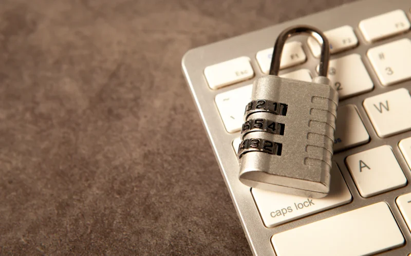 A padlock rests on a computer keyboard
