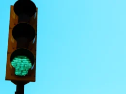 A traffic light with a green light on it