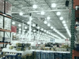 A wide aisle in a brightly lit warehouse store