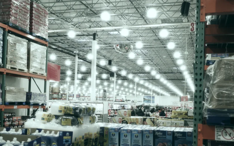 A wide aisle in a brightly lit warehouse store