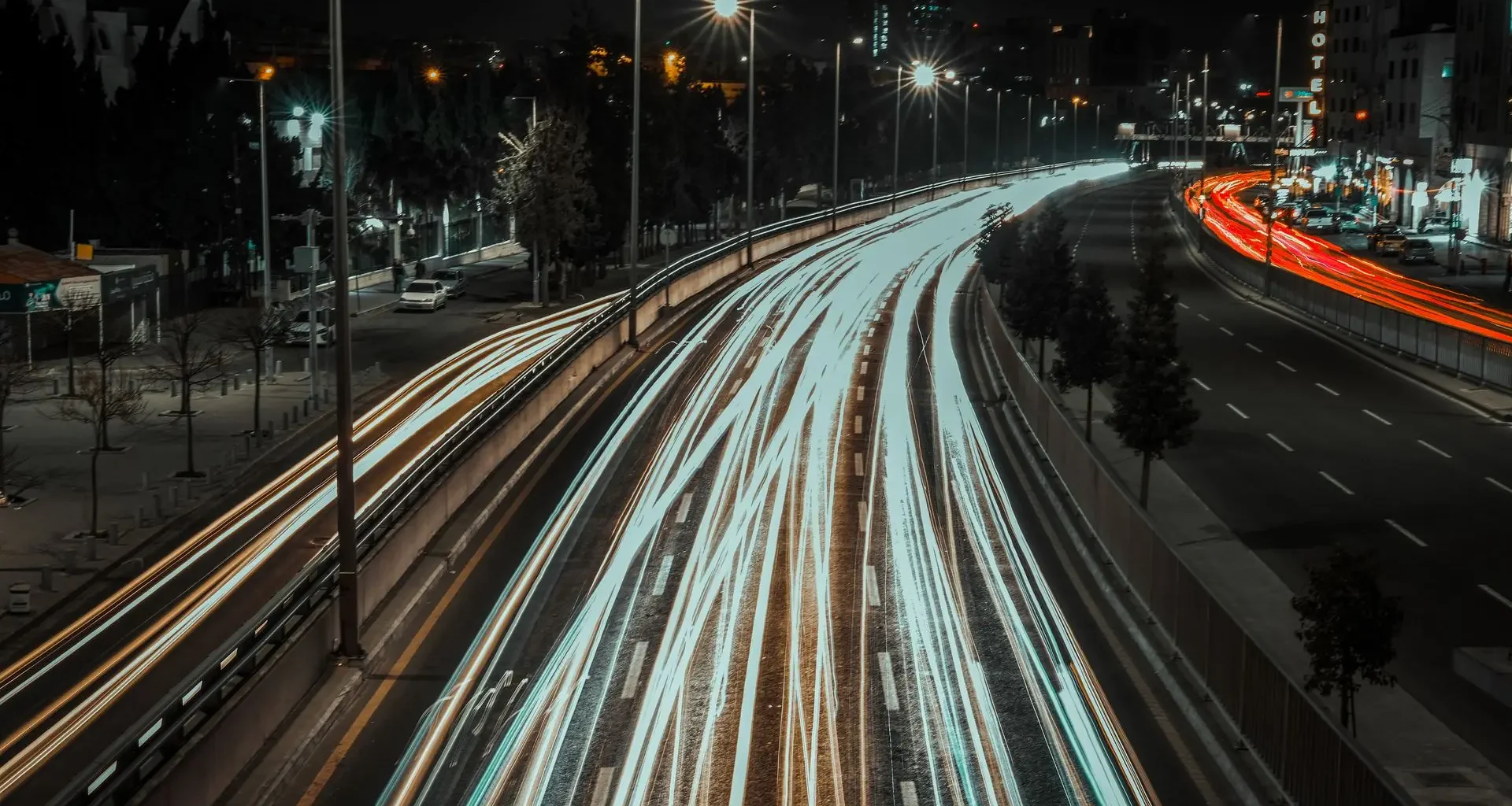 Light trails from traffic on a city highway at night