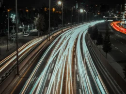 Light trails from traffic on a city highway at night