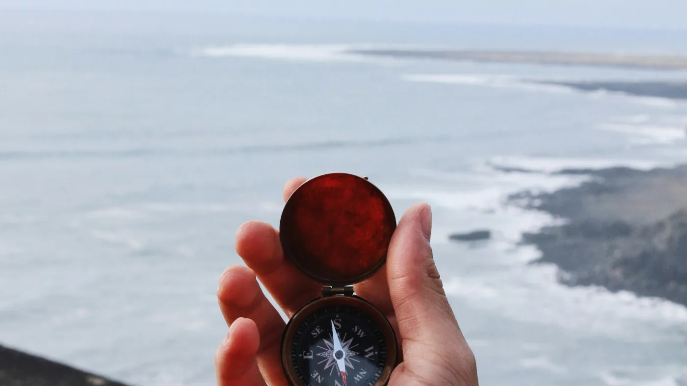 A compass held in an open hand