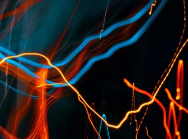Orange and blue light streaks on a black background, an abstract stand-in for the AI training opt-out signal