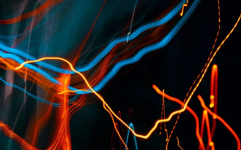 Orange and blue light streaks on a black background, an abstract stand-in for the AI training opt-out signal