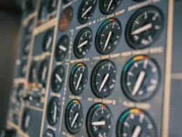 Close-up of an aircraft cockpit instrument panel with dials and switches