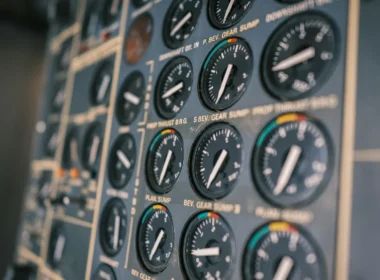 Close-up of an aircraft cockpit instrument panel with dials and switches