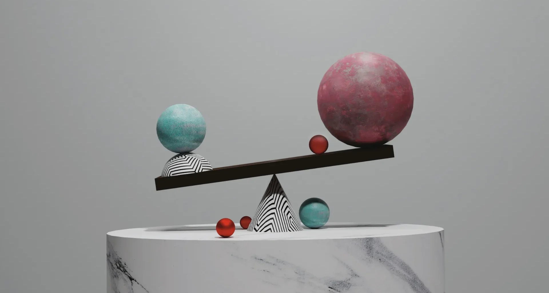A balance scale with two spheres on a marble pedestal against a grey background