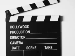 Black and white film clapperboard on a plain white background