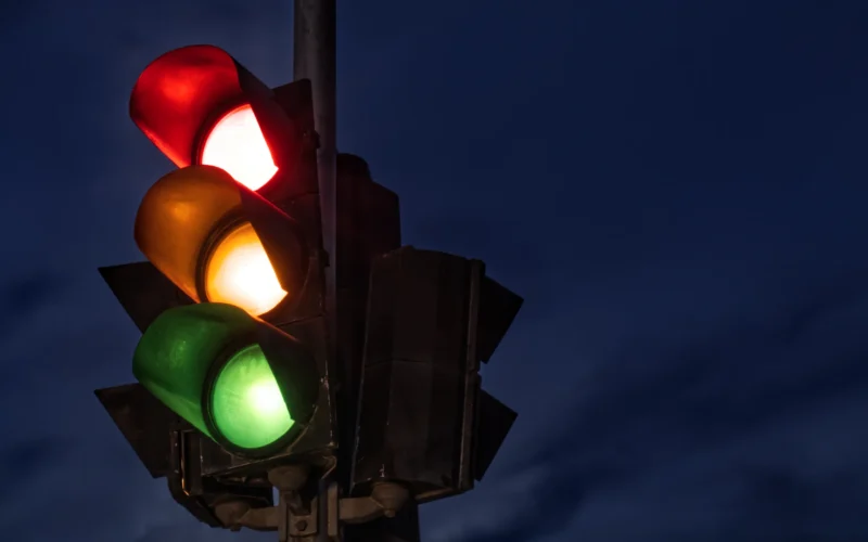 Black traffic light turned on during night time