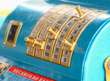 A blue cash register sitting on a shop counter
