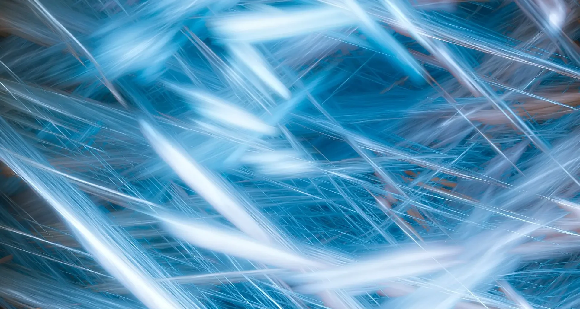 Pale blue light streaks crossing a dark blue background, an abstract image of compute time on a Canada EuroHPC link