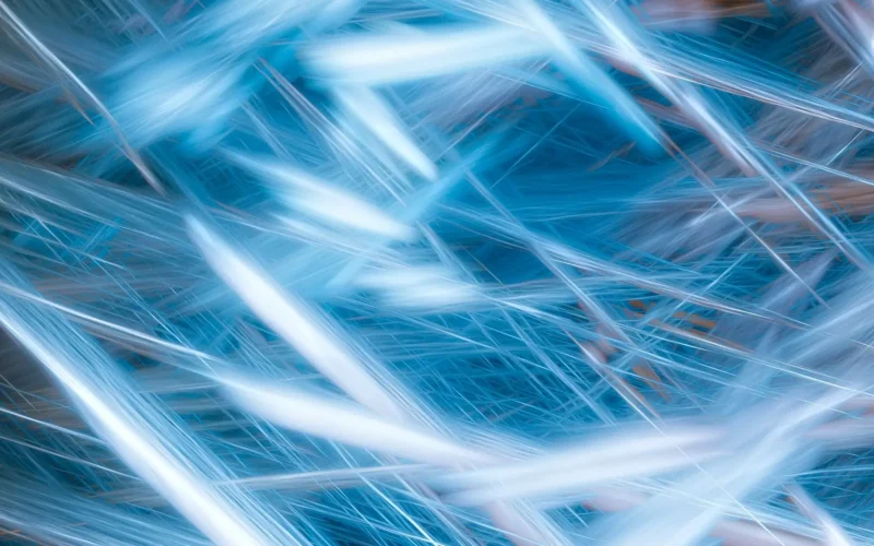 Pale blue light streaks crossing a dark blue background, an abstract image of compute time on a Canada EuroHPC link