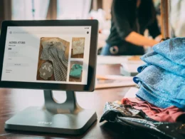 Tablet point-of-sale screen in a small clothing shop, the kind of online store AI agent attacks went after