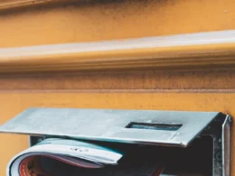 A brochure pushed through a door mail slot