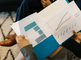 Printed business report with charts, like the Anthropic S-1 risk factors and financial tables