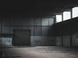 Empty building with a closed roller shutter