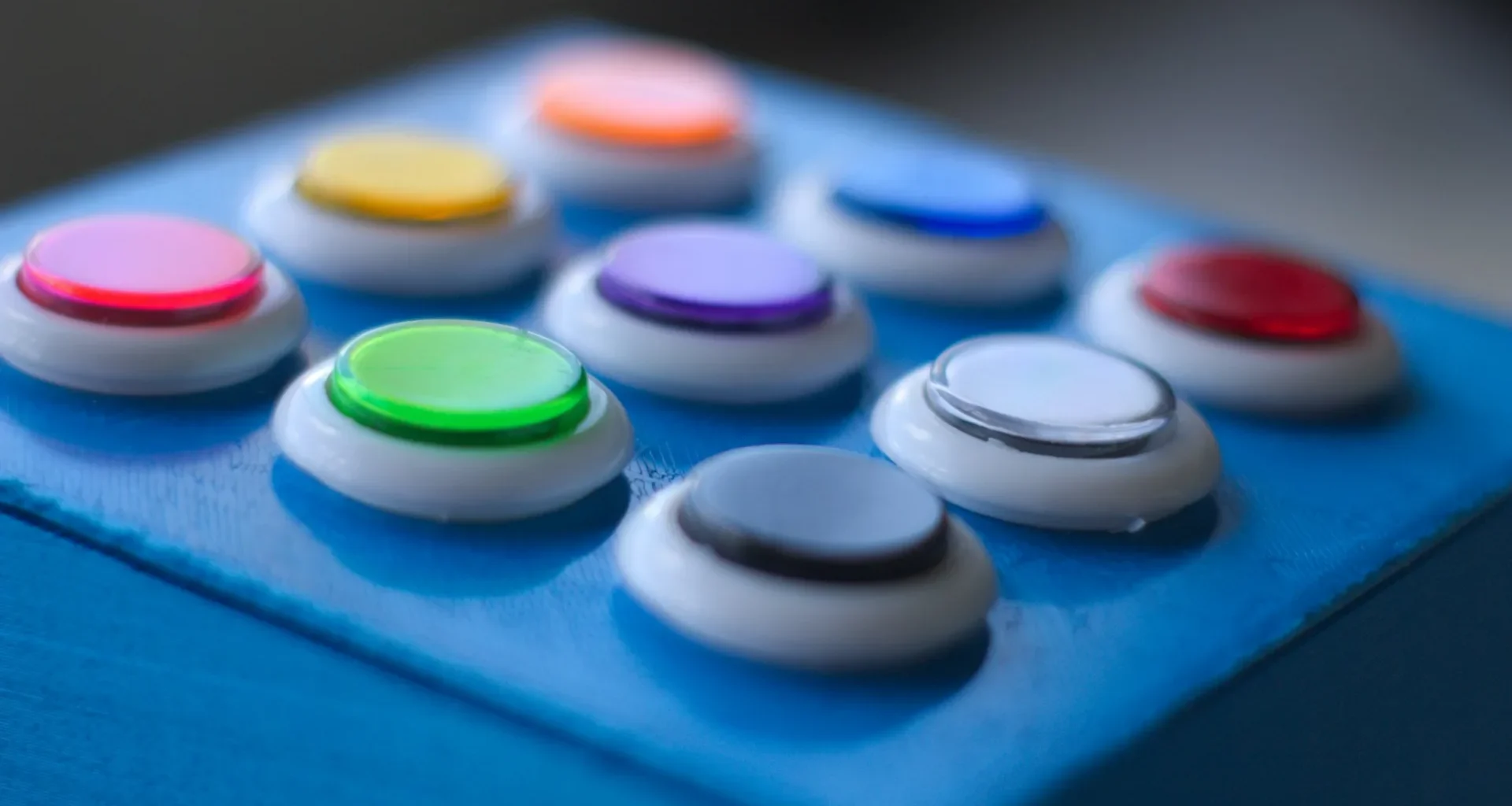Blue, white, green, yellow and red buttons
