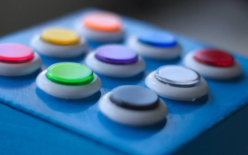 Blue, white, green, yellow and red buttons