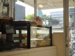 Counter with display case and 'order' sign