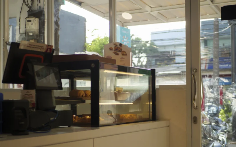 Counter with display case and 'order' sign