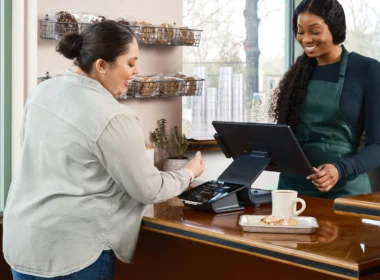 Customer paying a cashier at a counter in a shop