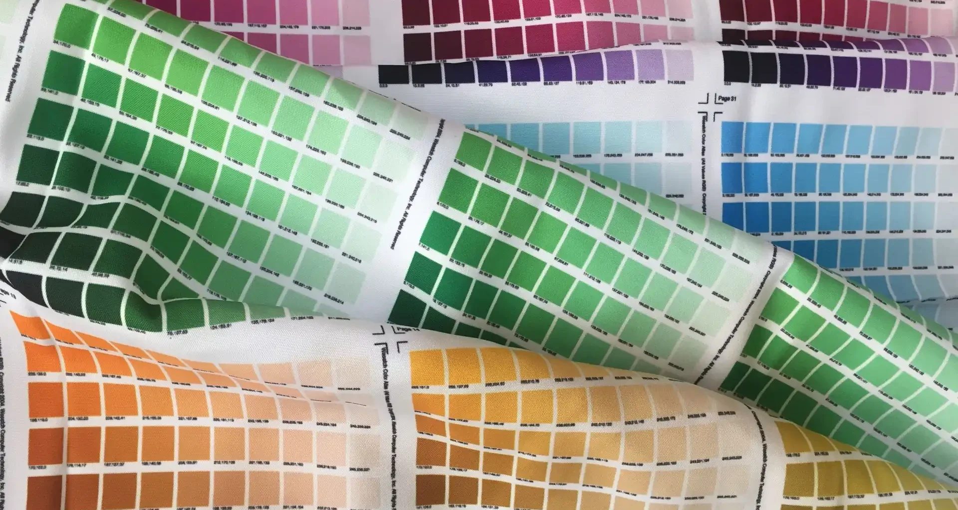 Rows of colour swatches printed on rippled fabric, a stand-in for the product data enrichment a catalogue needs