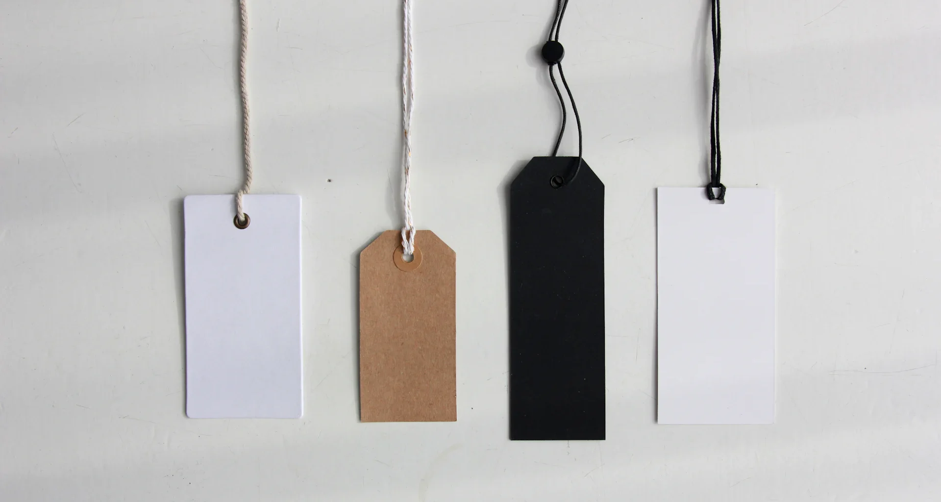 Four paper card tags.