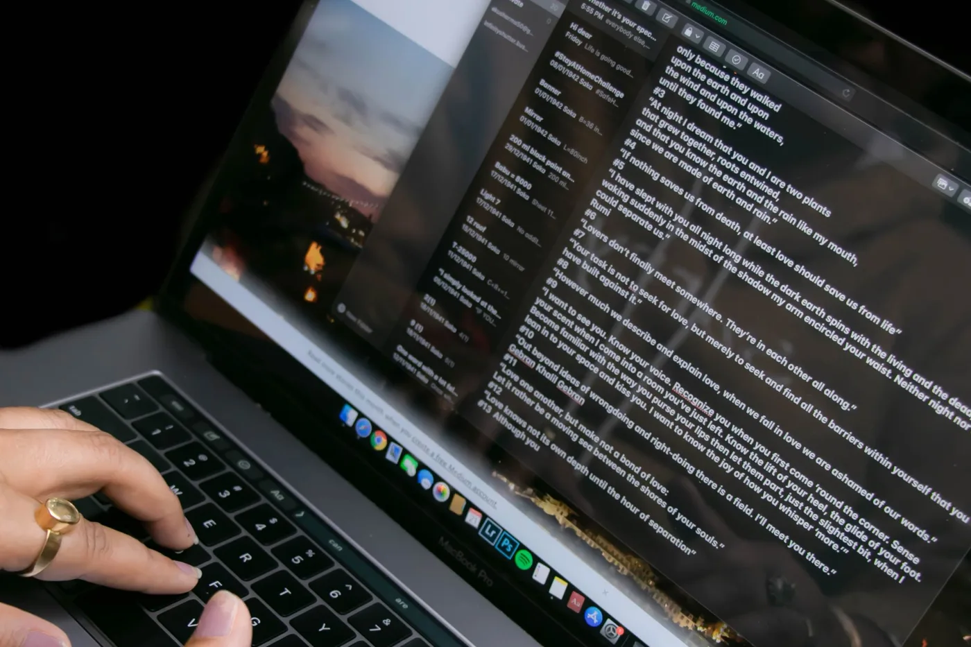 Hands typing on a laptop with an email app open on screen.