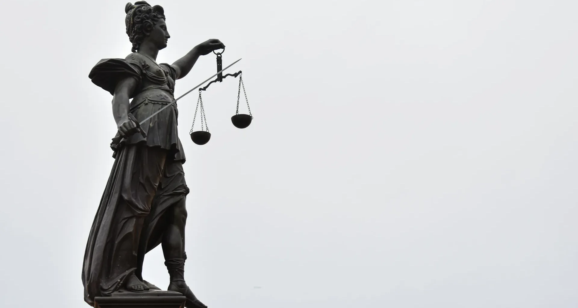 A statue of Lady Justice holding a set of scales