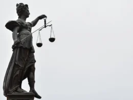 A statue of Lady Justice holding a set of scales
