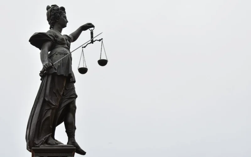 A statue of Lady Justice holding a set of scales