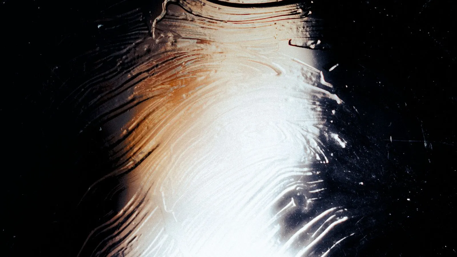 Light falling across a textured glass surface, an abstract stand-in for Claude conversation monitoring