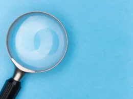 Magnifying glass on white table