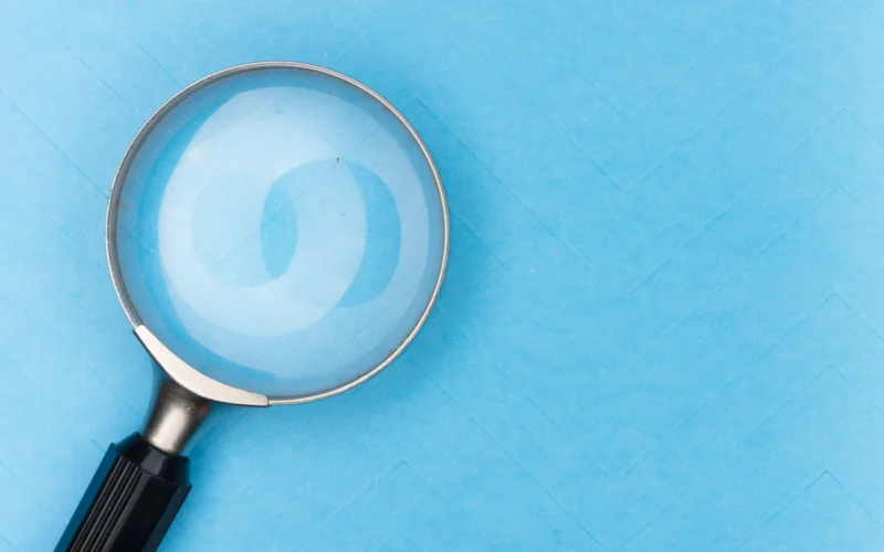 Magnifying glass on white table