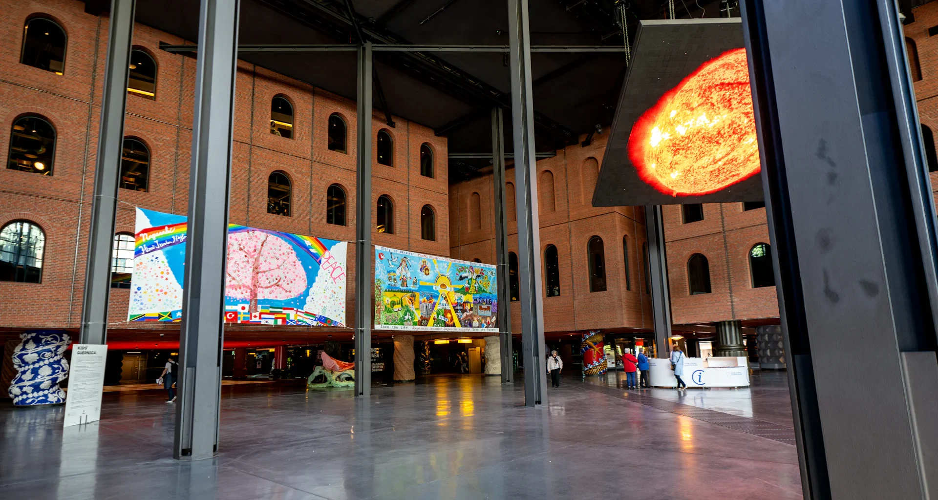 Modern art exhibition with colorful paintings on walls