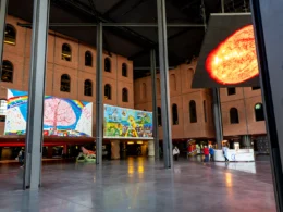 Modern art exhibition with colorful paintings on walls