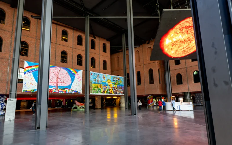 Modern art exhibition with colorful paintings on walls