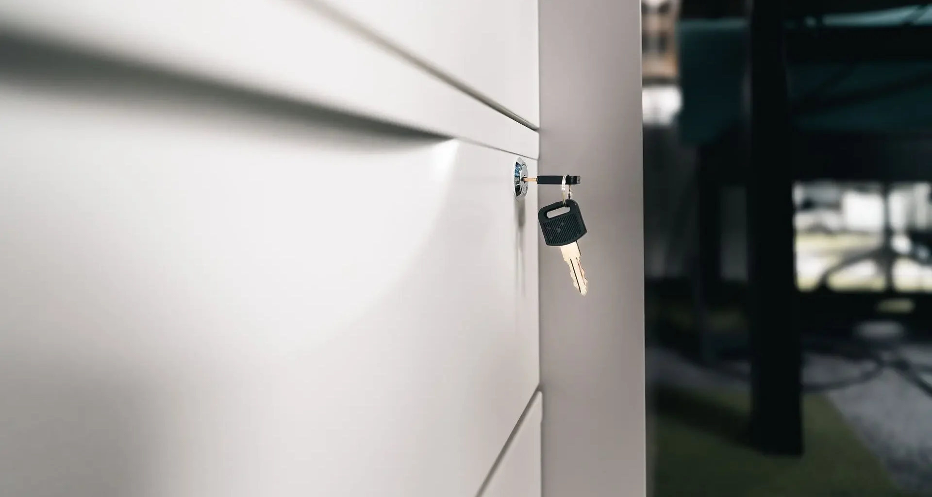 Key left in a locked office cabinet, a reminder to secure files under Alberta's deepfake law