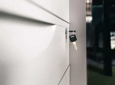 Key left in a locked office cabinet, a reminder to secure files under Alberta's deepfake law