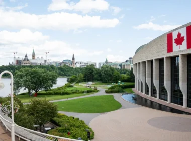 Parliament Hill in Ottawa seen across the river, where federal human in the loop AI rules are set