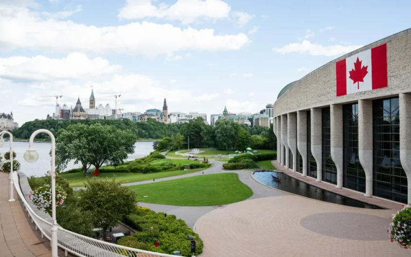 Parliament Hill in Ottawa seen across the river, where federal human in the loop AI rules are set