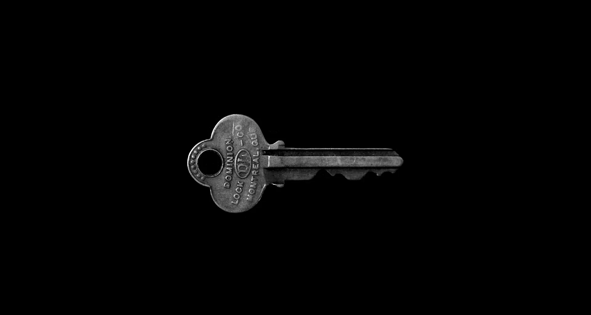 Photo of key against black background