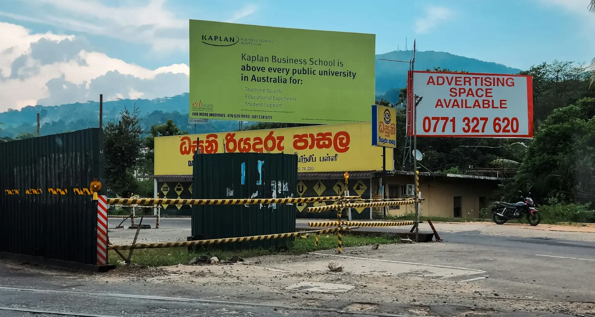 Roadside billboards standing under a clear blue sky